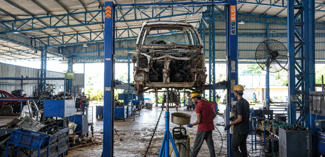Industrial Garage with Elevated Wrecked Car