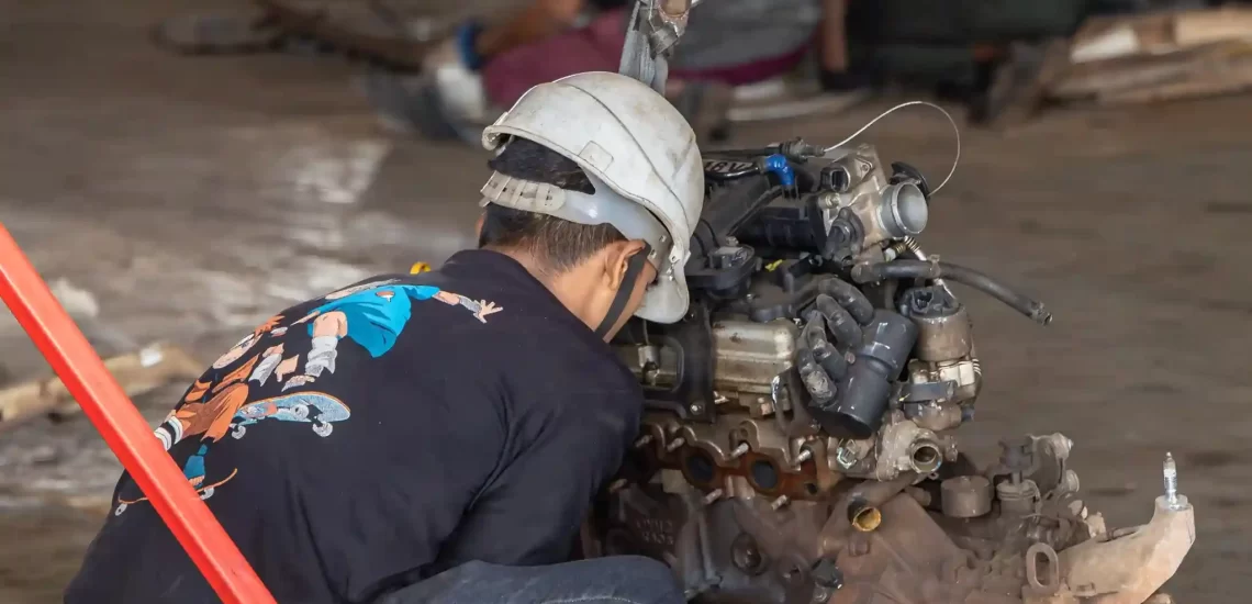 Car being dismantled for scrap metal, following government guidelines.