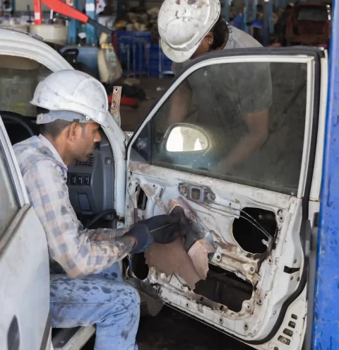 Professional vehicle dismantling at an authorised scrapping facility in Goa.