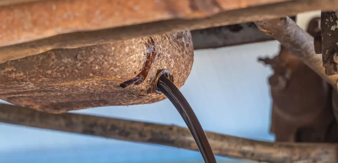 Engine oil being safely drained during vehicle scrapping in Goa 